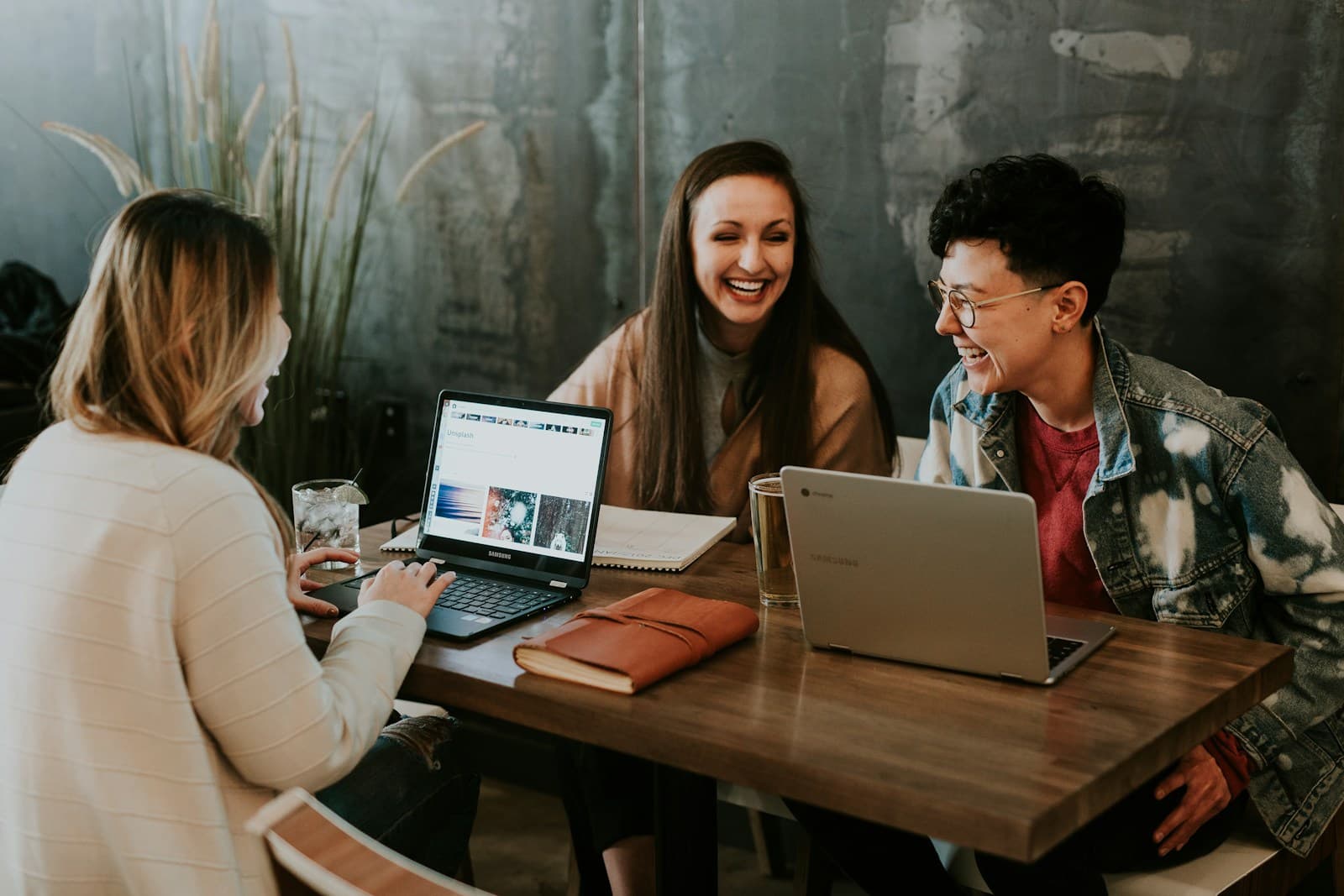 People collaborating around a laptop